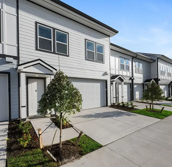 row of 2 story townhouses with garage