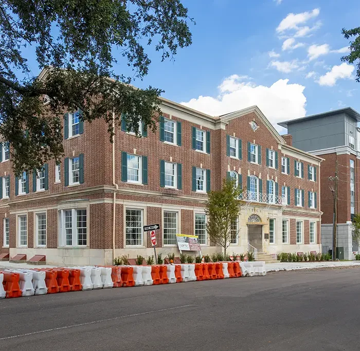 apartment buildings in downtown jacksonville, one is a brick building and one is new construction