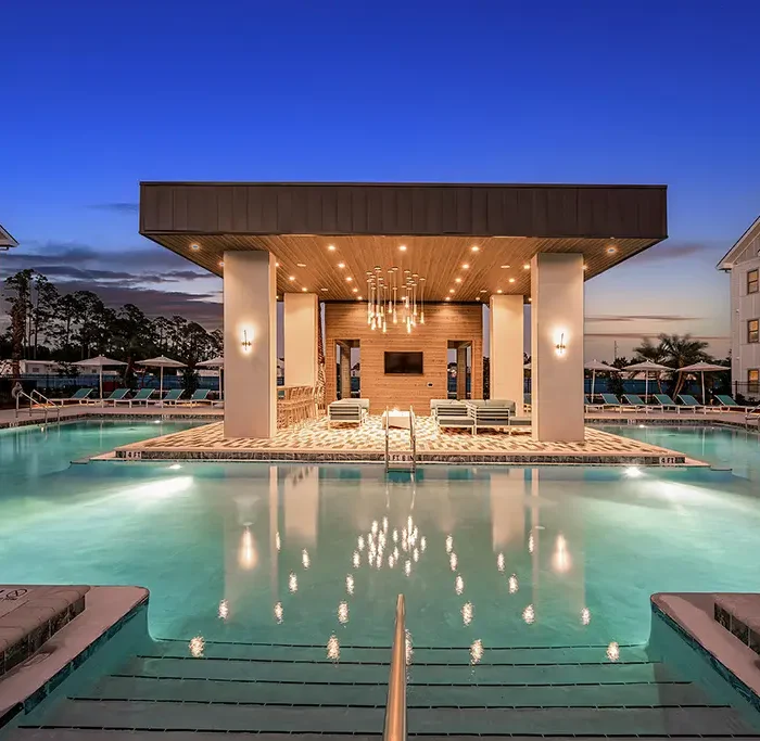 pool house pergola structure at night