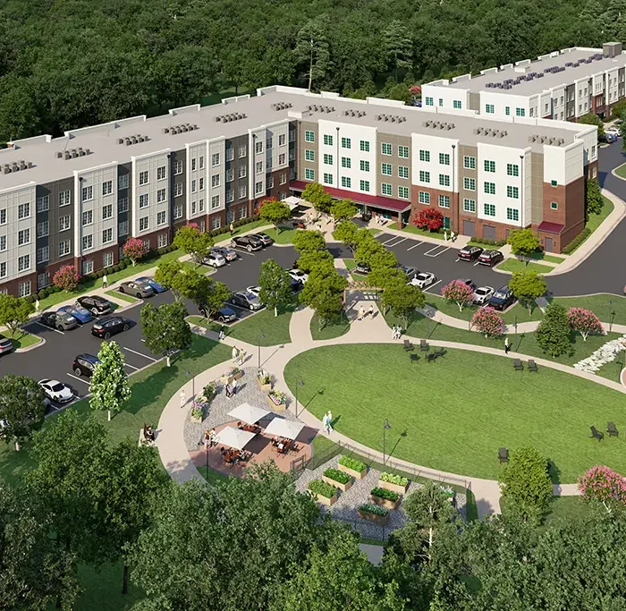 aerial view rendering of apartment community with large grass lawn